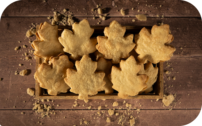 Maple leaf-shaped cookies in a box